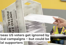 Election workers prepare to mail absentee ballots to Americans, including those living overseas. Allison Joyce/Getty Images